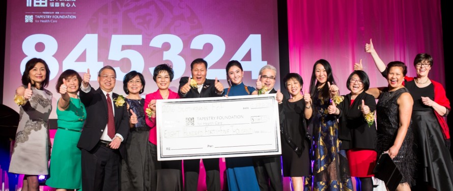 Sing Lim Yeo, O.B.C. (centre), and wife Patricia Yeo (4th from left) joined members of the 2016 Scotiabank Feast of Fortune Fundraising Committee on stage on Feb. 6 to reveal $845,324 raised to support Mount Saint Joseph Hospital.