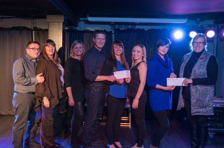 Real Estate Board of the Fredericton Area representatives present donations to two local charities. (Submitted photo)